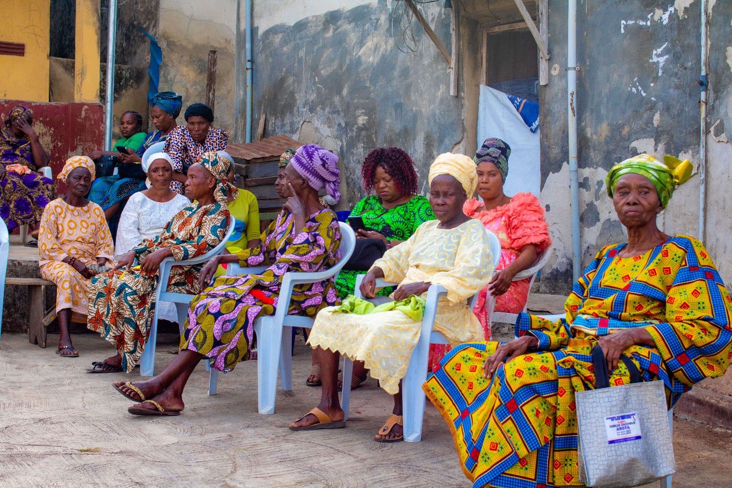 Smiling elderly woman holding hands with a volunteer